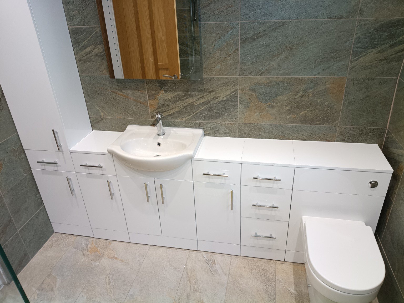 Fitted bathroom storage and basin